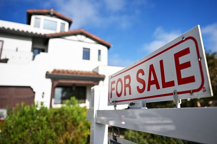 A for sale sign is displayed outside of a home for sale on August 16, 2024 in Los Angeles. Economic anxiety stemming from the Middle East conflict is starting to seep into the housing market.