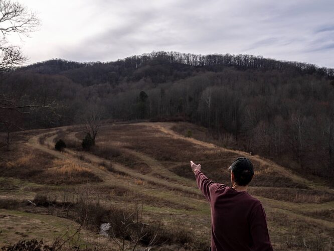 Timm Martin points out areas that are part of the Jellico Vegetation Management proposal to clear cut and log on 10.000 acres inside the Daniel Boone National Forest. Credit: Jared Hamilton