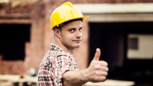 Construction worker gesturing thumbs up