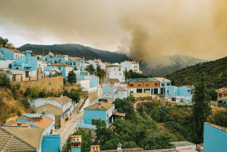 Wildfire smoke over a picturesque Spanish town